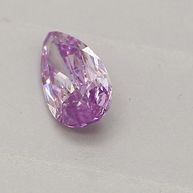 0.16 carat fancy intense pinkish purple pear diamond certified by GIA