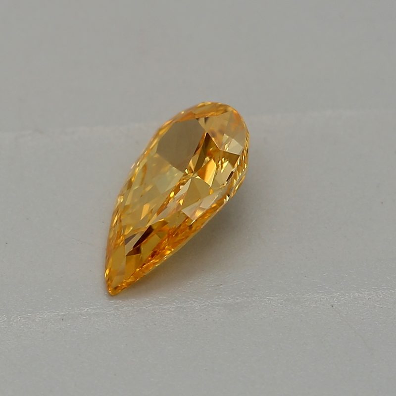 0.33 carat fancy vivid yellow-orange pear diamond certified by GIA