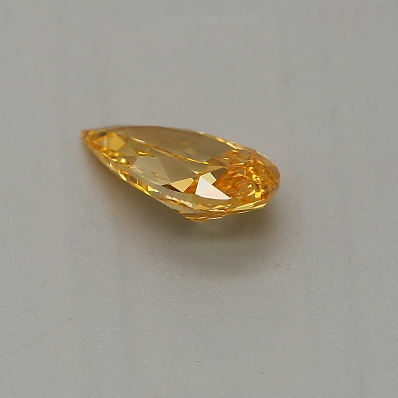 0.33 carat fancy vivid yellow-orange pear diamond certified by GIA