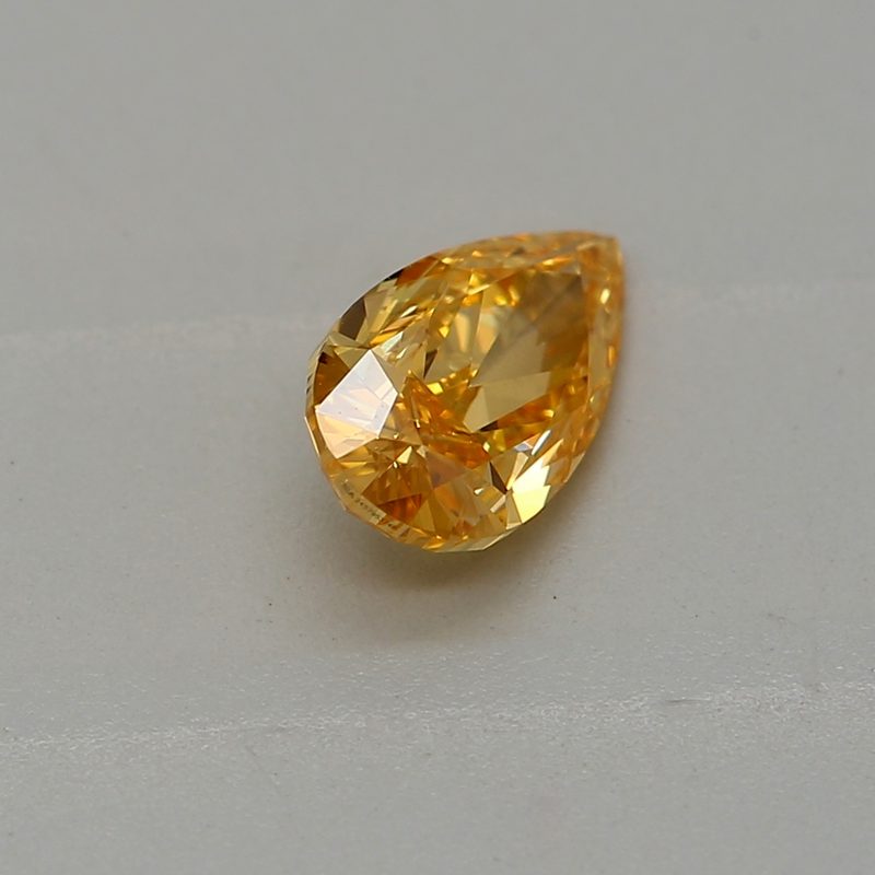 0.33 carat fancy vivid yellow-orange pear diamond certified by GIA