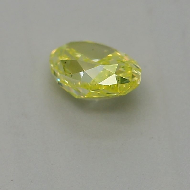 0.23 carat fancy intense green-yellow oval diamond certified by GIA