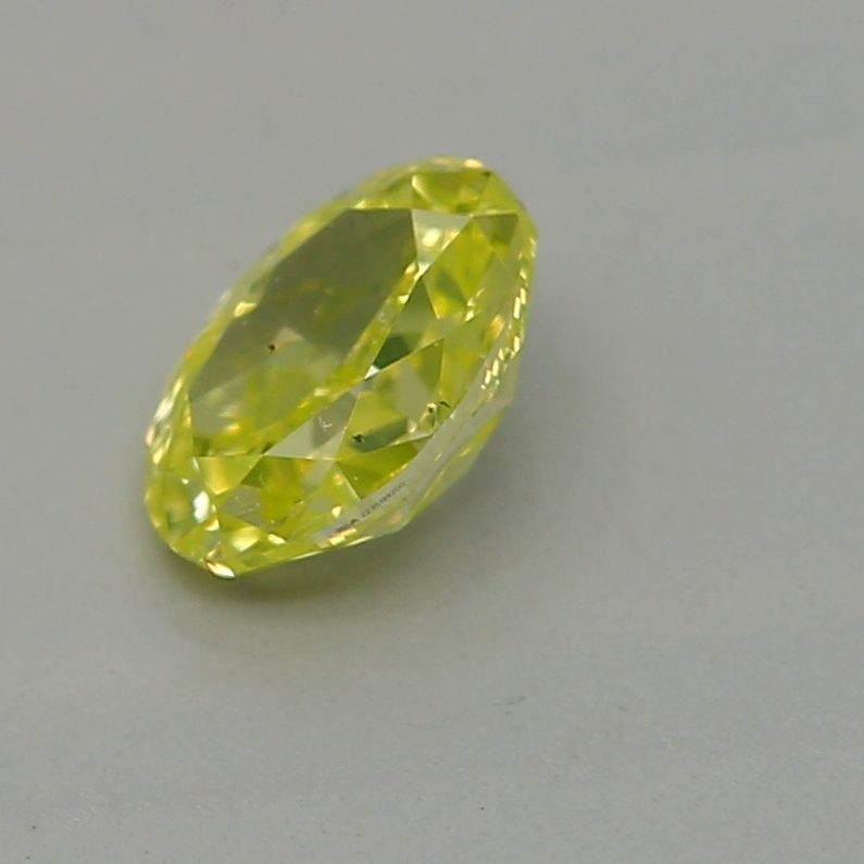 0.23 carat fancy intense green-yellow oval diamond certified by GIA