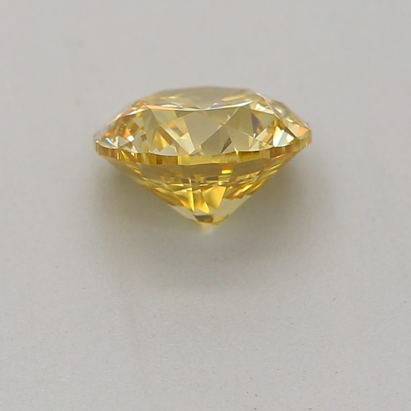 0.5 carat fancy intense yellow round diamond certified by GIA