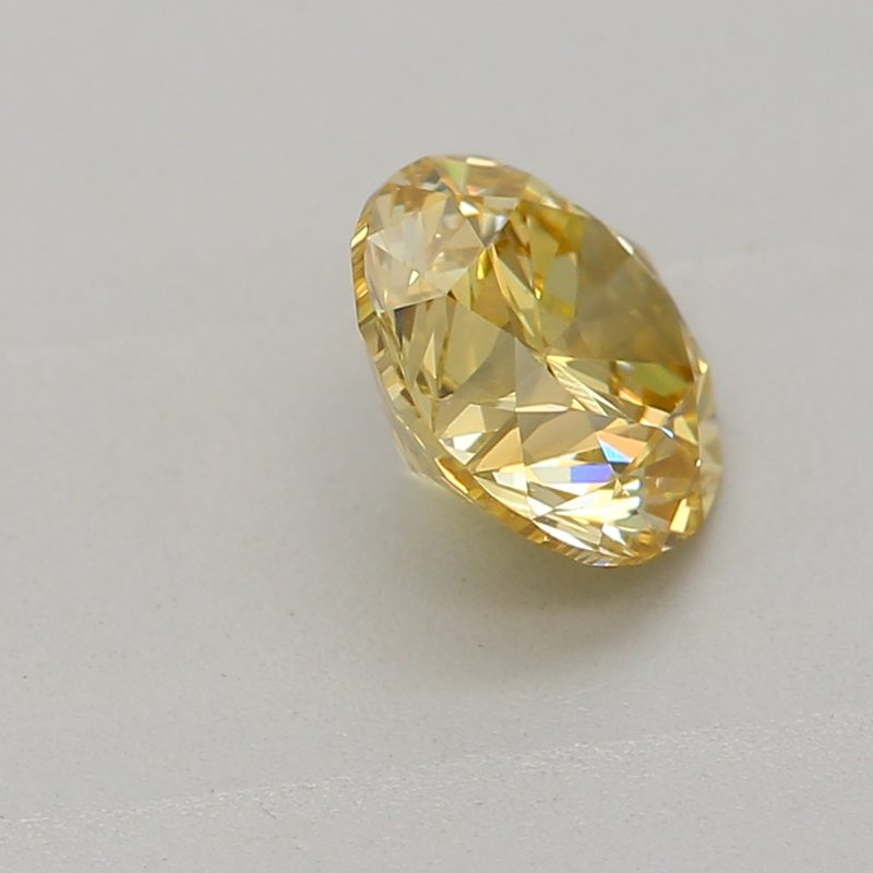 0.5 carat fancy intense yellow round diamond certified by GIA