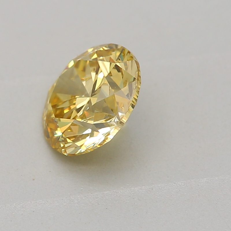 0.5 carat fancy intense yellow round diamond certified by GIA