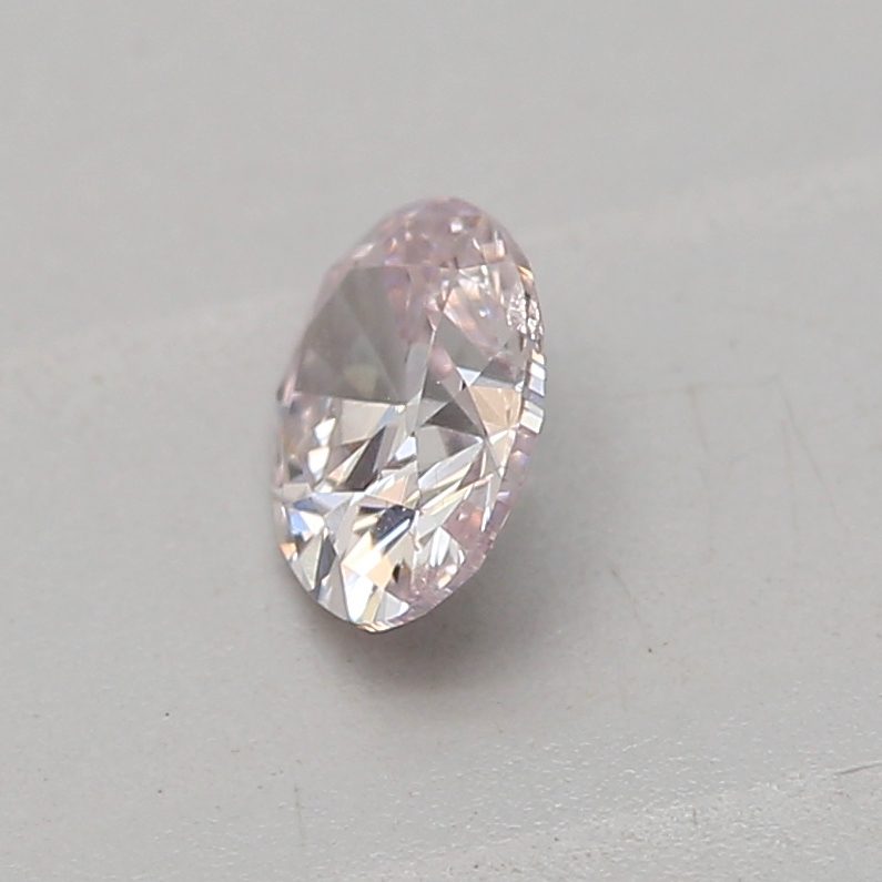 0.18 carat light pink oval diamond certified by GIA