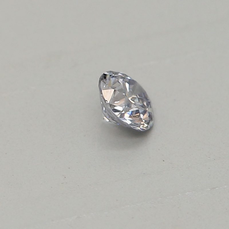 0.06 carat light blue round diamond certified by GIA