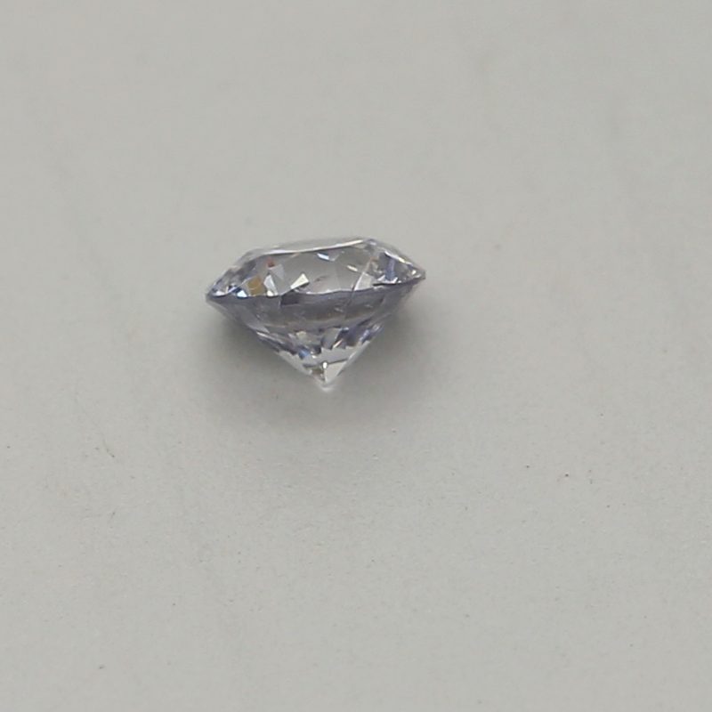 0.06 carat light blue round diamond certified by GIA
