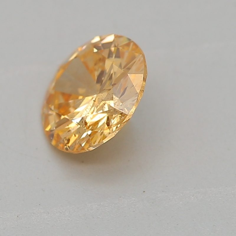 0.33 carat fancy intense yellow-orange round diamond certified by GIA