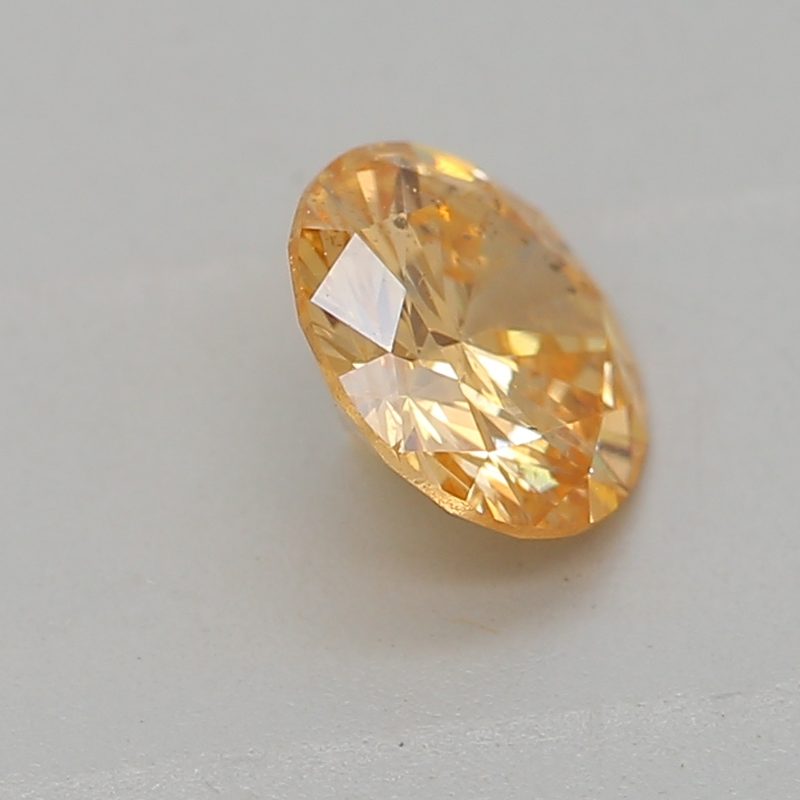 0.33 carat fancy intense yellow-orange round diamond certified by GIA