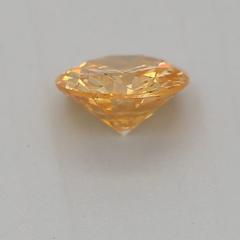 0.33 carat fancy intense yellow-orange round diamond certified by GIA