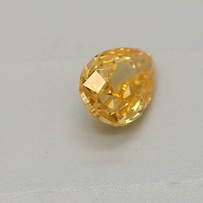 0.2 carat fancy vivid yellow-orange pear diamond certified by GIA