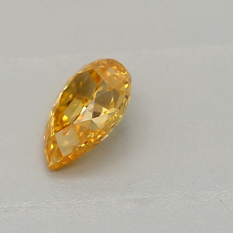 0.2 carat fancy vivid yellow-orange pear diamond certified by GIA