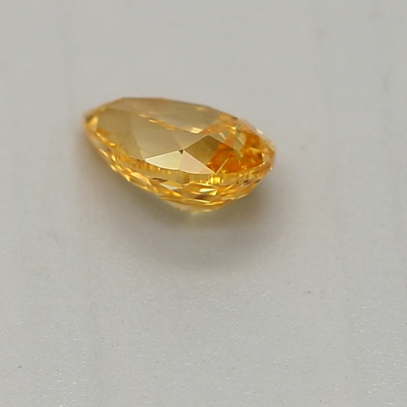 0.2 carat fancy vivid yellow-orange pear diamond certified by GIA